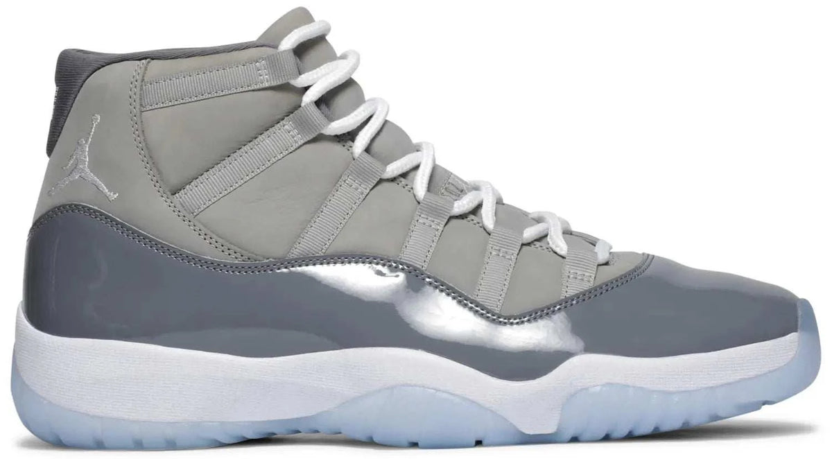 JORDAN 11 RETRO COOL GREY high-top sneaker in grey leather and mesh, with glossy overlays, white laces and icy blue sole.