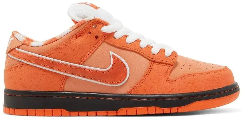 NIKE SB DUNK ORANGE LOBSTER low-top sneakers in orange suede and leather, with a white Swoosh and laces.